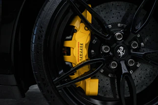 a close up of a yellow brake on a car