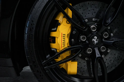 a close up of a yellow brake on a car