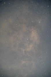 Close-up of a golden foil star map highlighting constellations with delicate shine.