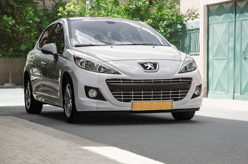 A sleek silver sedan parked on a sunlit city street, ready for a long-term rental adventure.