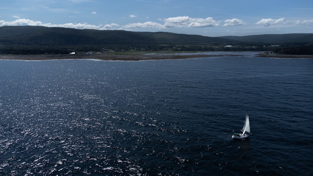 a sailboat in the middle of a large body of water