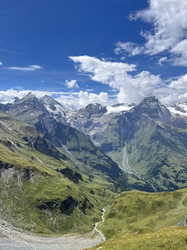 A vibrant billboard showcasing a travel ad with stunning mountain scenery.