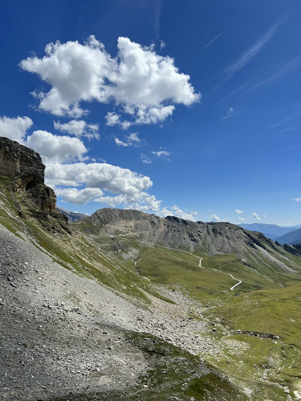 a view of a valley with a mountain in the background