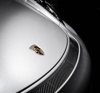 Colorful icon symbolizing automotive sector featuring a sleek car silhouette.