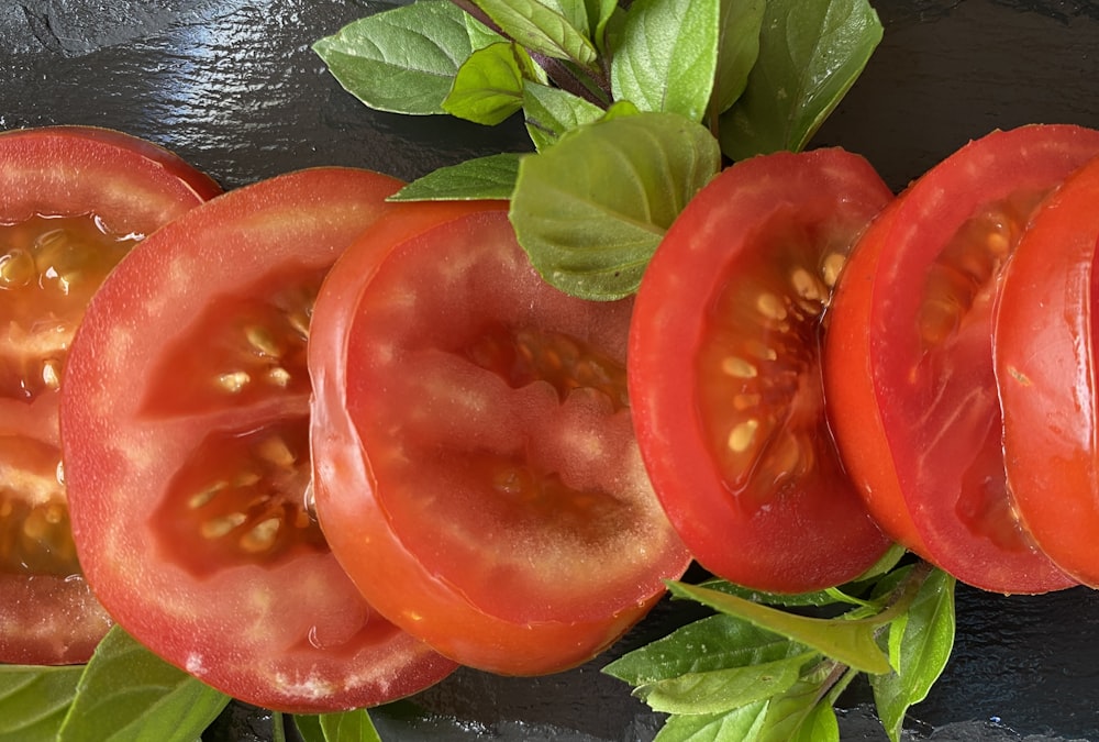 a close up of a sliced tomato on a table