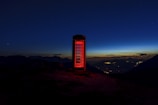 Sunset over the Riverside skyline with a silhouette of a red British telephone booth.