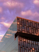 Completed commercial building exterior with clean architectural lines at sunset.