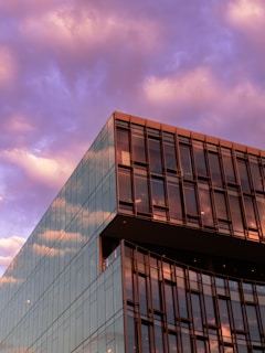 A completed commercial building showcasing clean architectural lines at sunset.