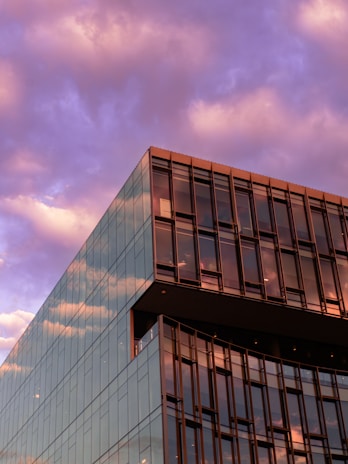 A completed commercial building showcasing clean architectural lines at sunset.