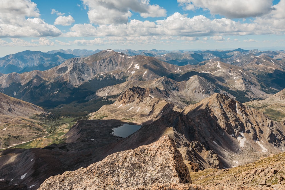 a view of a mountain range from the top of a mountain