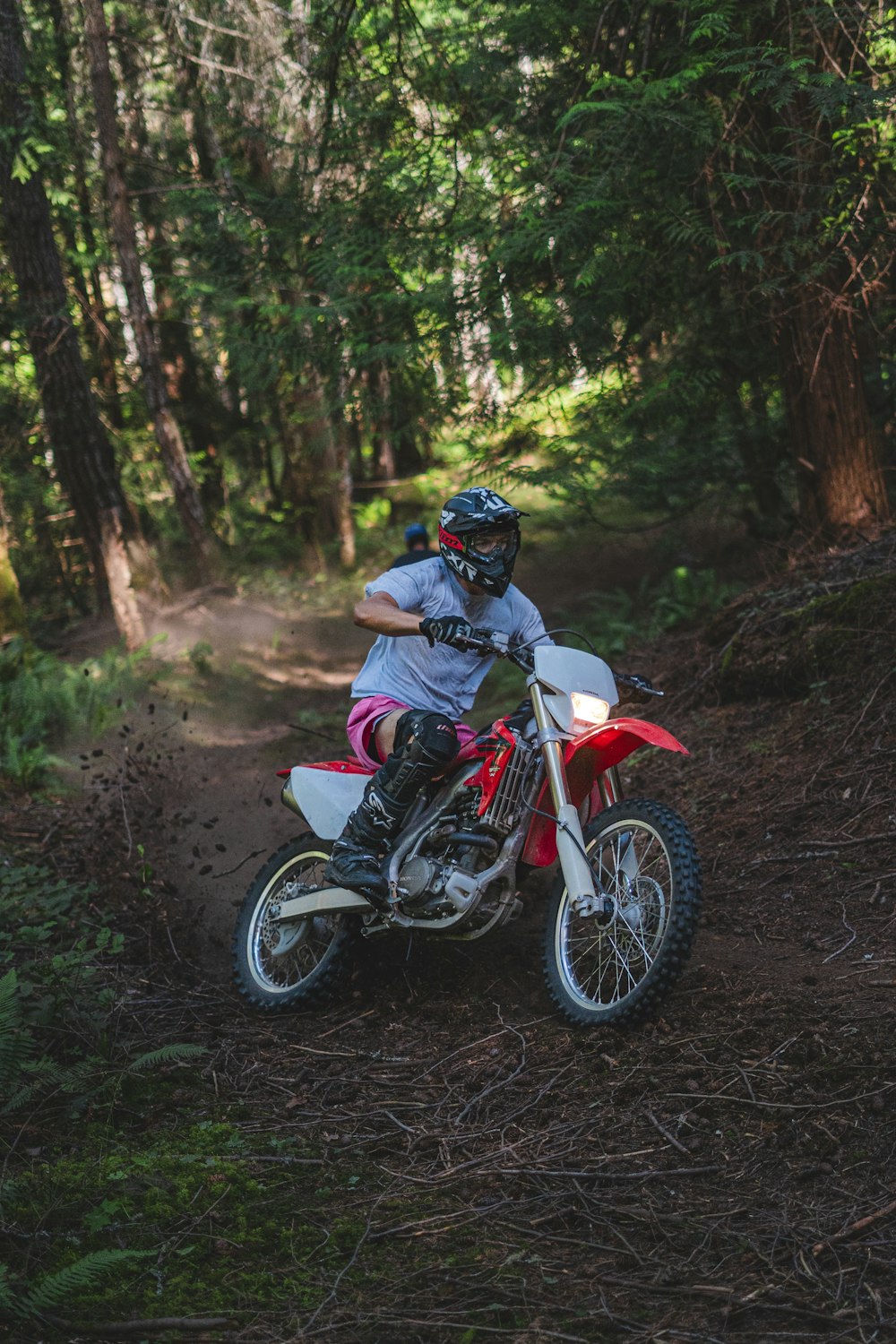 a person riding a dirt bike on a trail