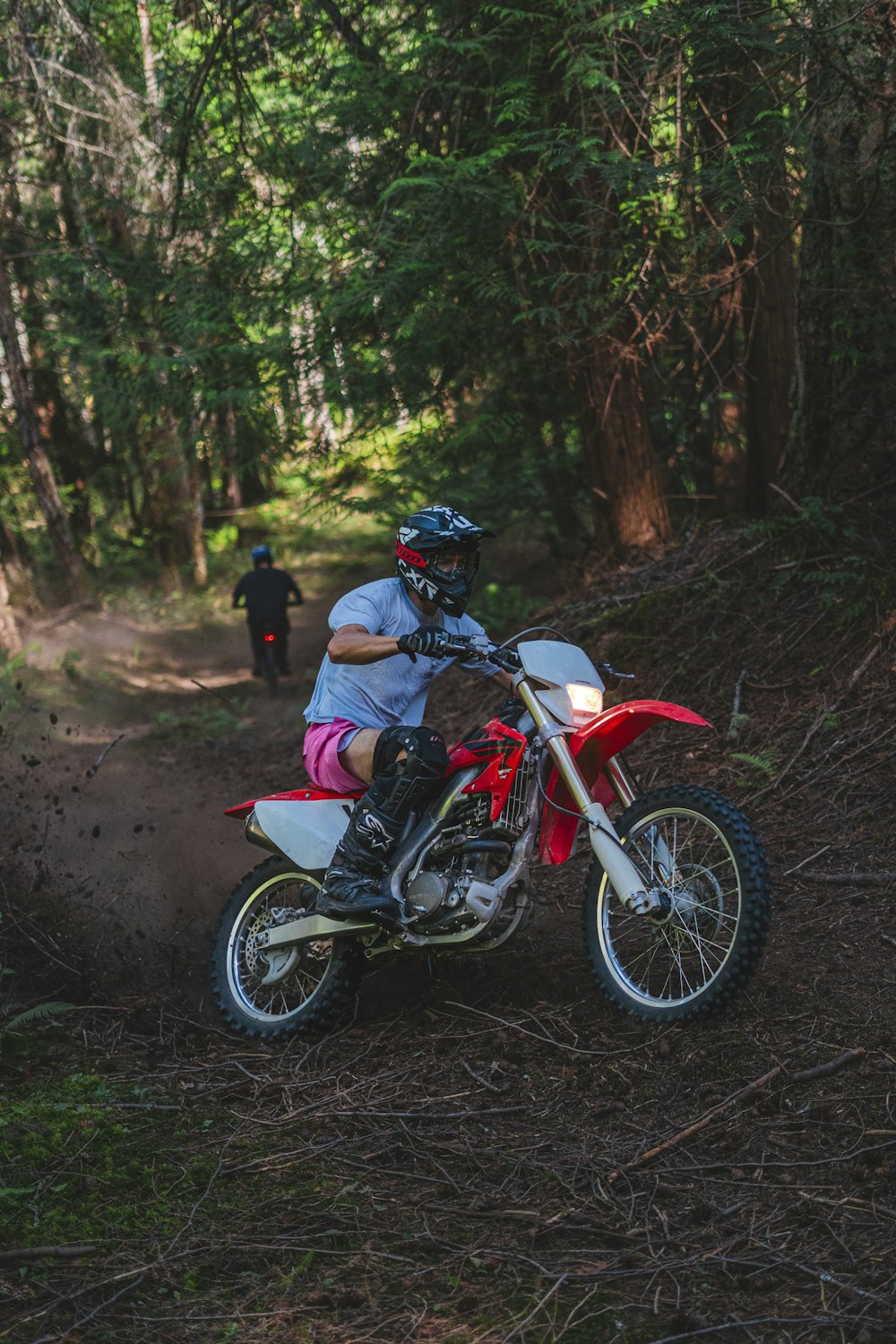 a person riding a dirt bike on a trail