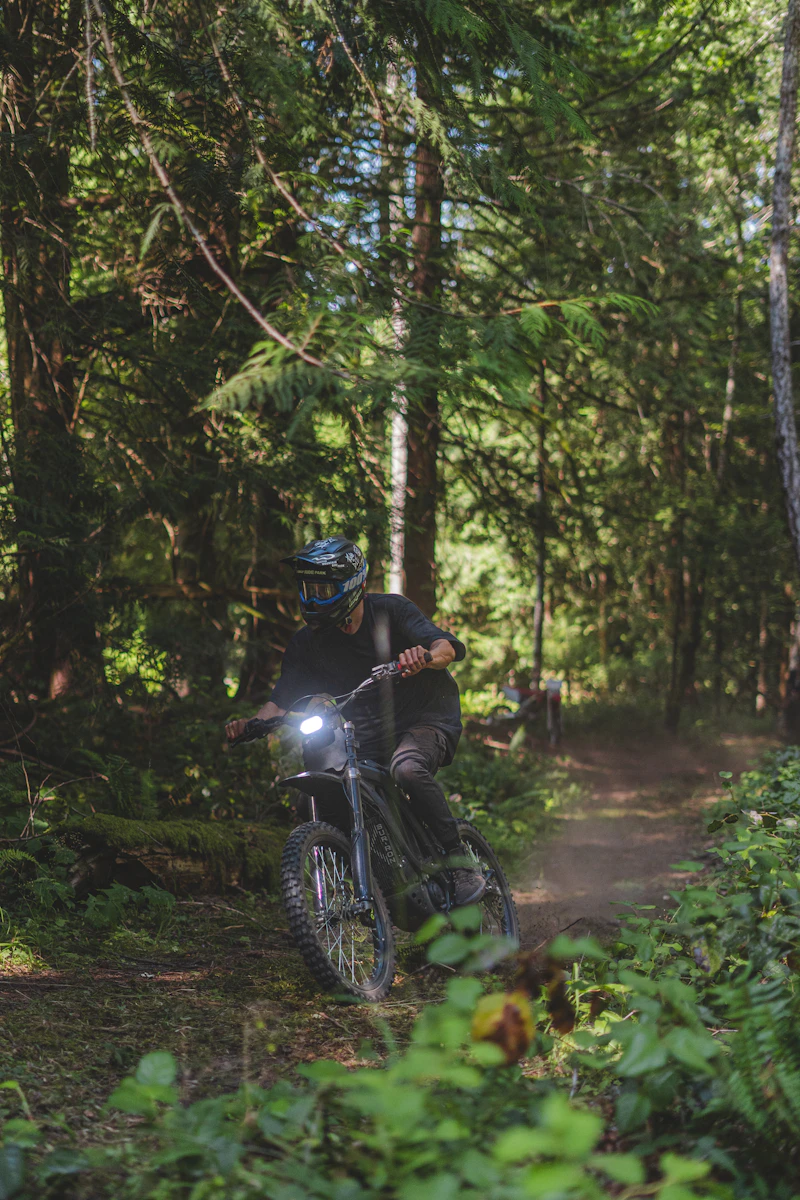 Electric dirt bike ripping a trail at full power