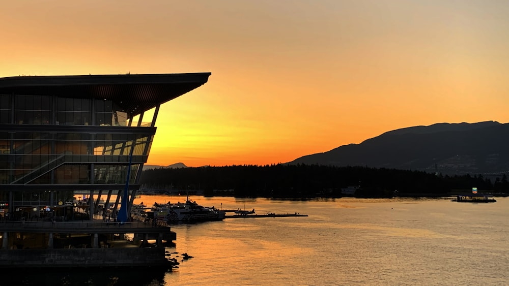 a sunset view of a boat dock with boats in the water