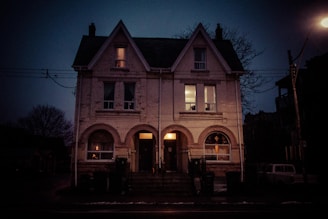 A small duplex nestled in a leafy neighborhood, with neighbors chatting nearby.