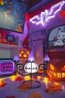 A dimly lit garage decorated with cobwebs and glowing jack-o'-lanterns.