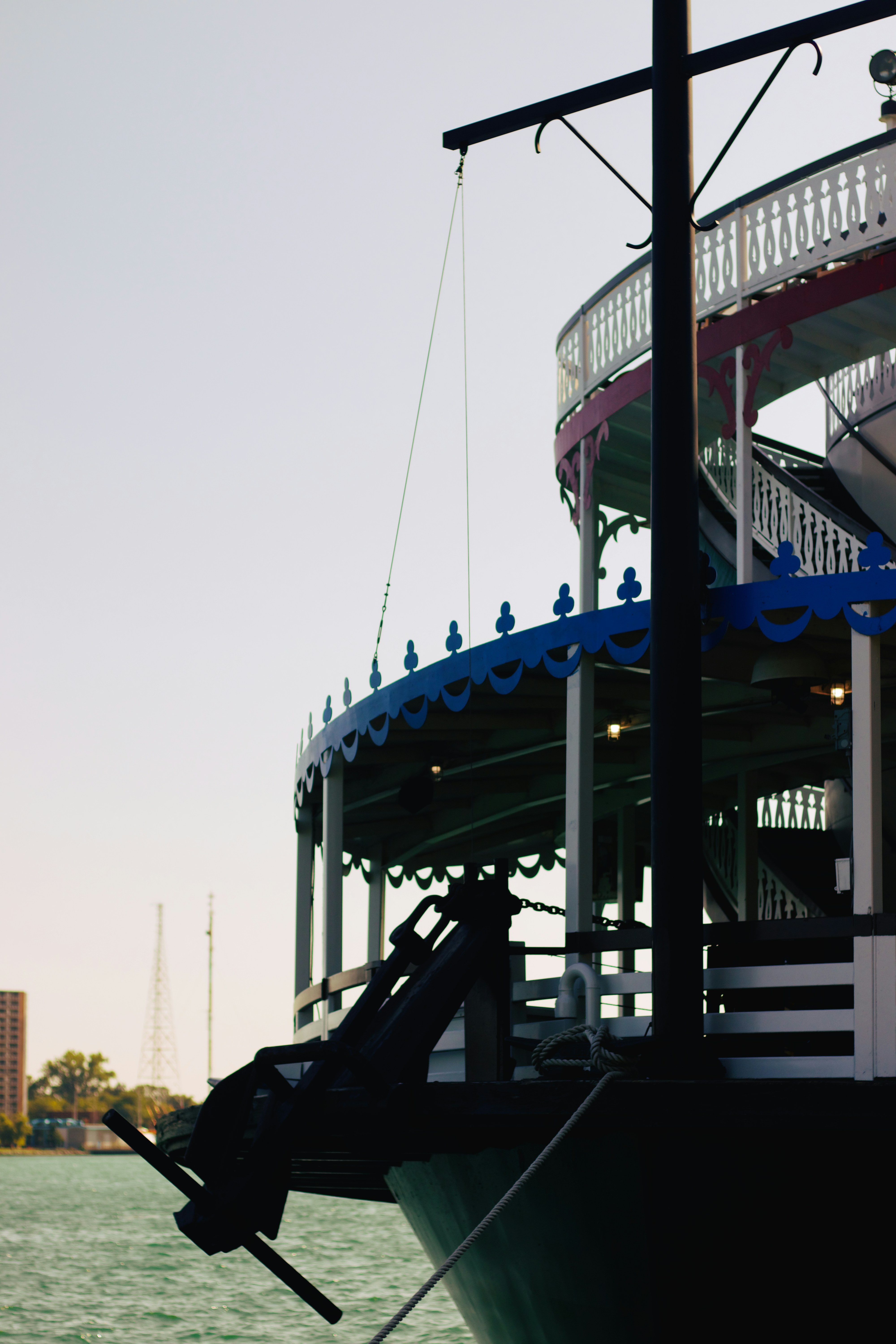 a boat is docked in the water near a pier
