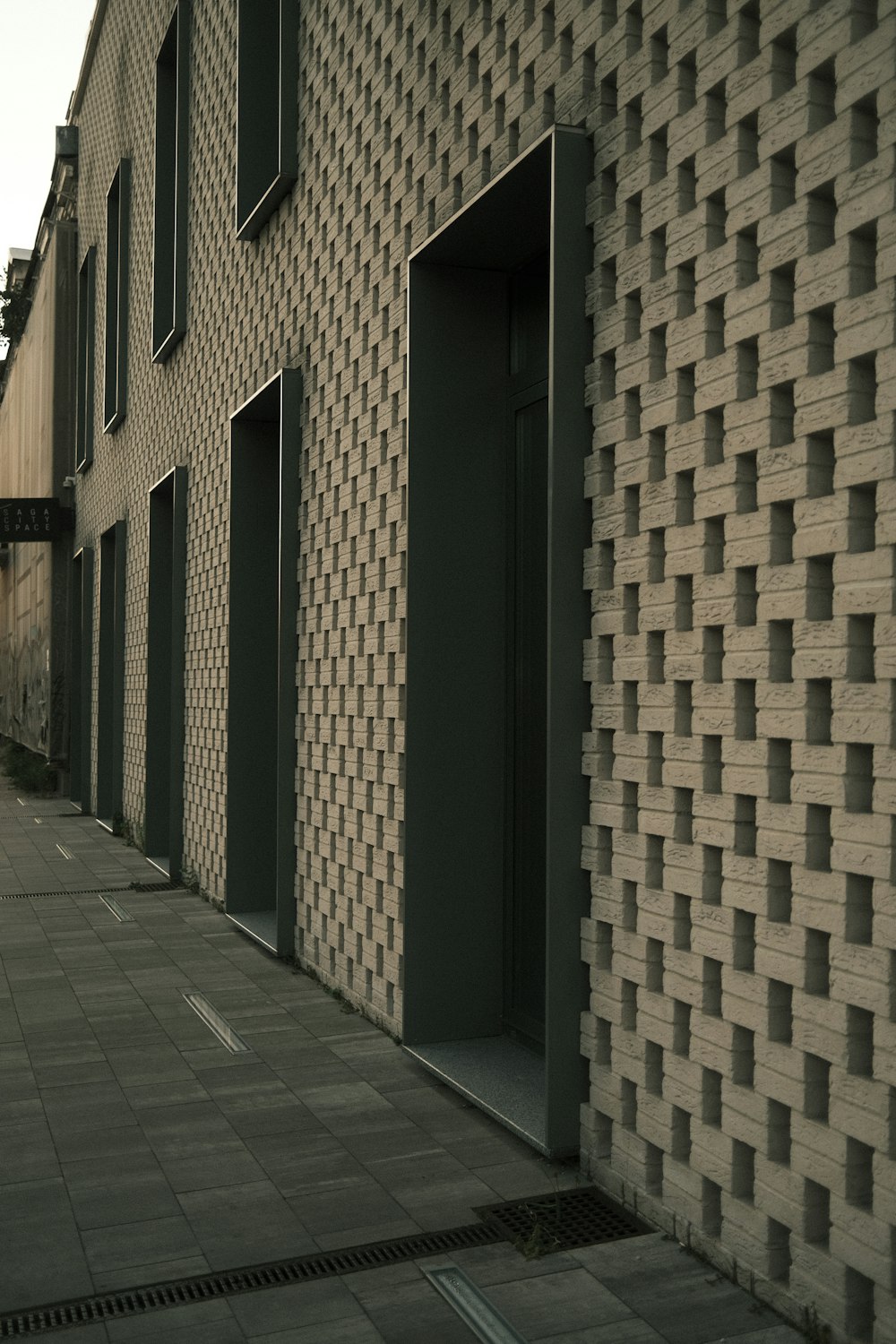 a brick building with a clock on the side of it