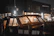 A cozy ship cabin with the JL Marine portable humidifier softly glowing on a wooden shelf.