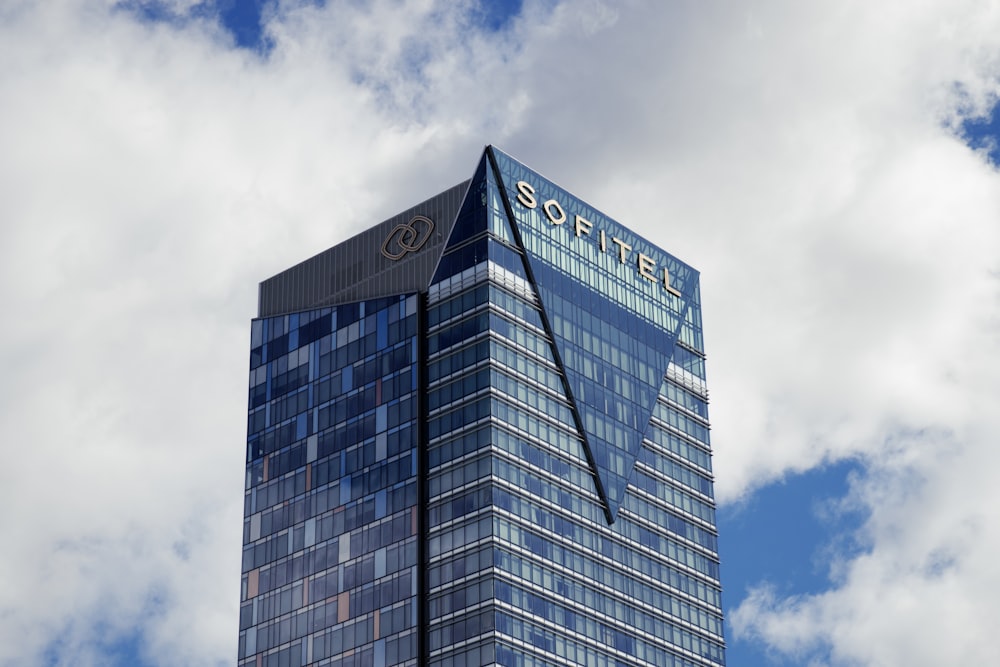 a very tall building with a sky background