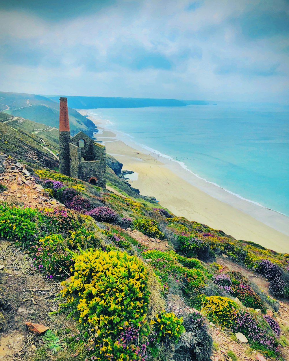 a scenic view of a beach and the ocean