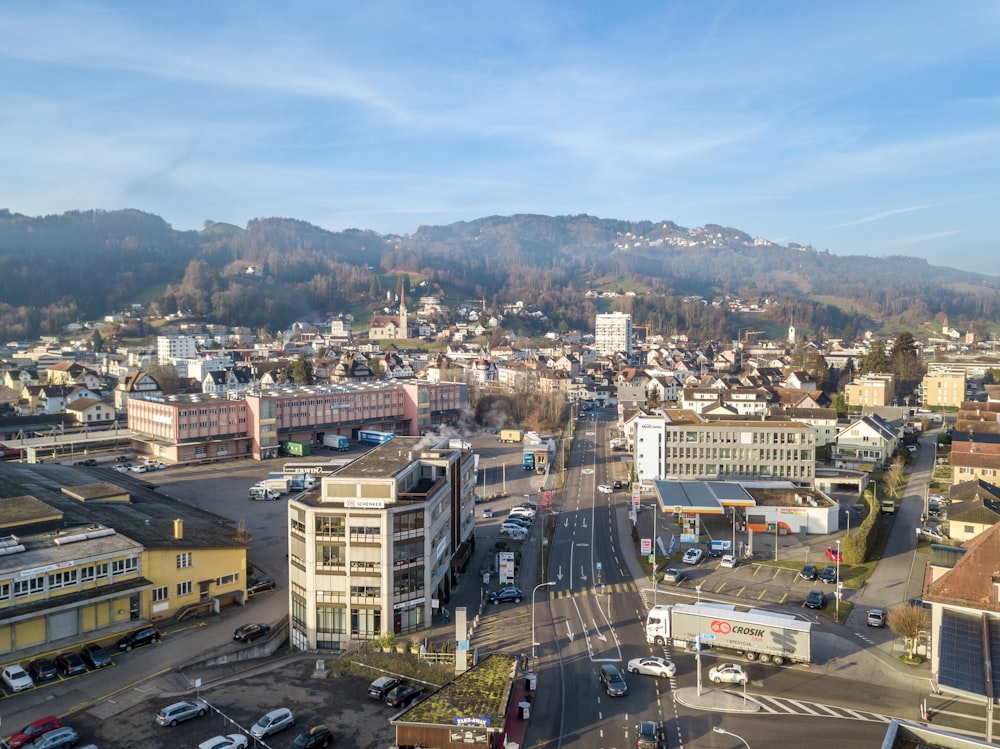 a view of a city with mountains in the background