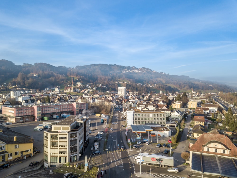 a view of a city with mountains in the background