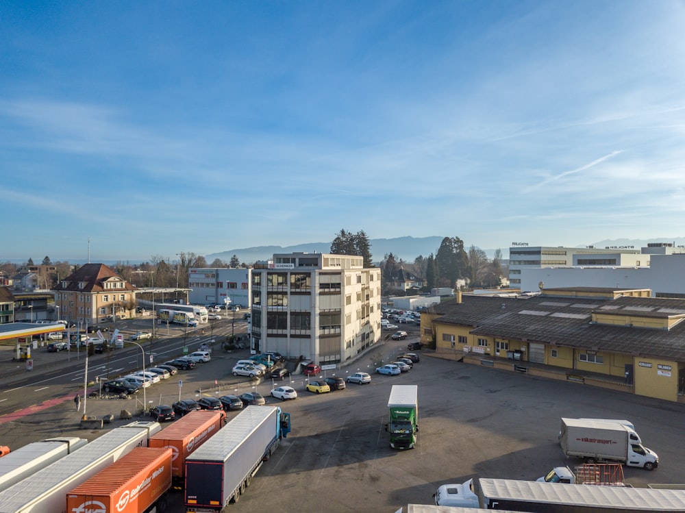 a parking lot filled with lots of cars and trucks