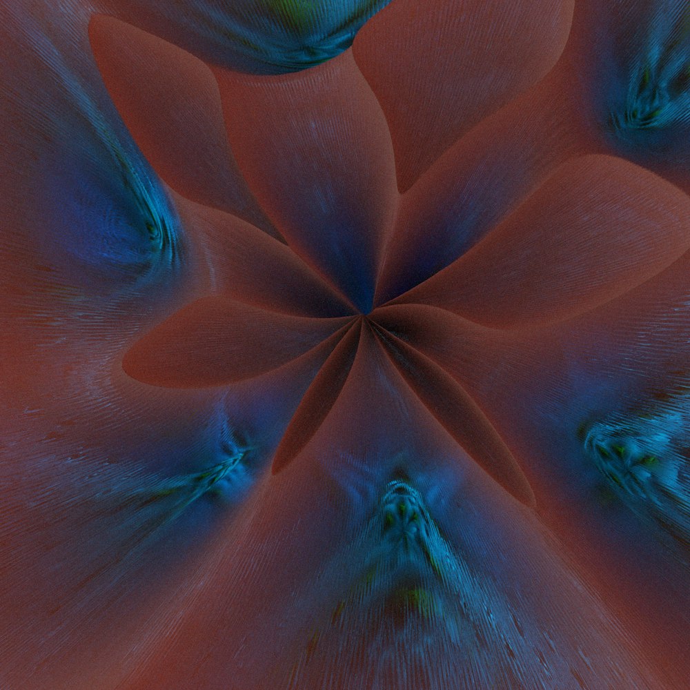 a close up of a red flower with a blue center