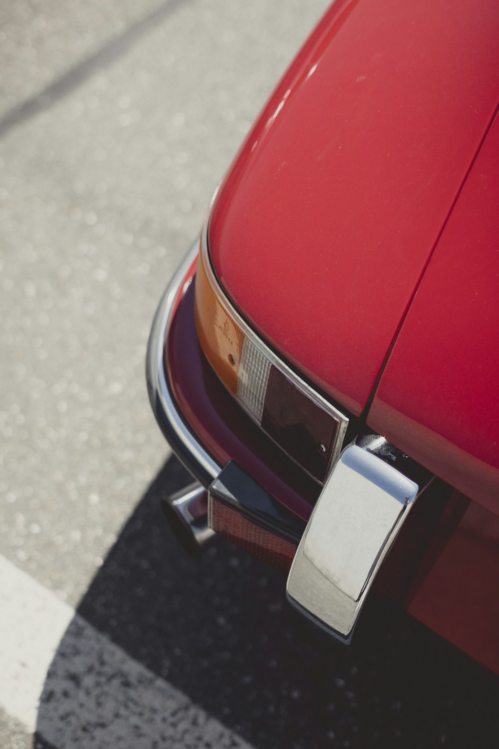 a red car parked on the side of the road