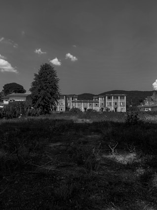 A simple placeholder image showing the outline of the historic Fallsvale Schoolhouse surrounded by trees.