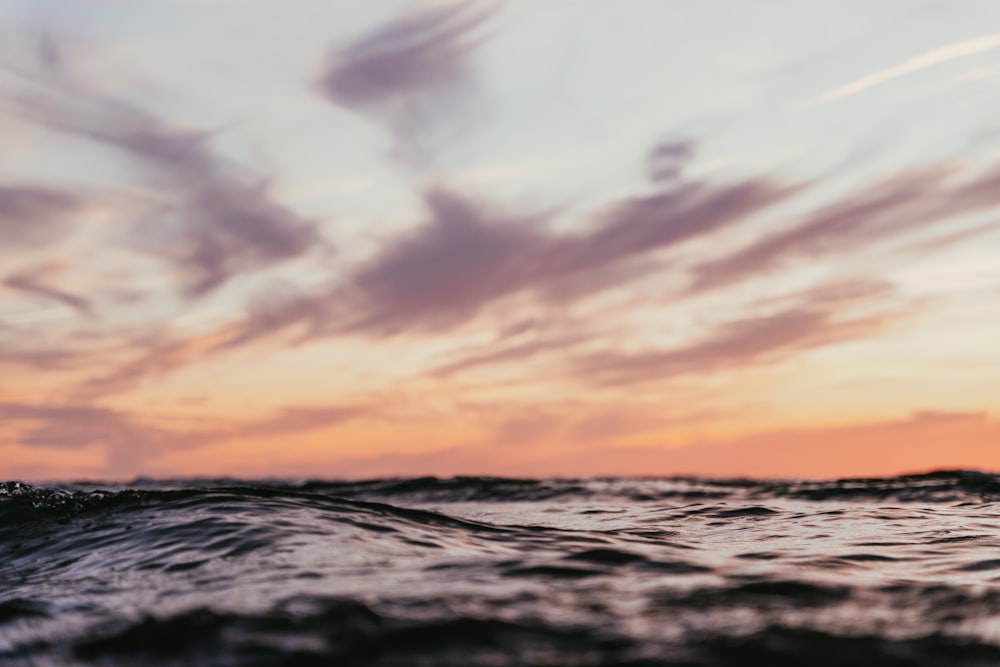 a picture of a sunset over the ocean