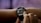A person is interacting with a smartwatch on their wrist, displaying sleep consistency information through a graph with numerical data.