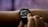 A person is interacting with a smartwatch on their wrist, displaying sleep consistency information through a graph with numerical data.