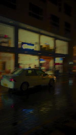 A candid image of a car navigating through bustling city streets at dusk, lights reflecting off wet pavement.