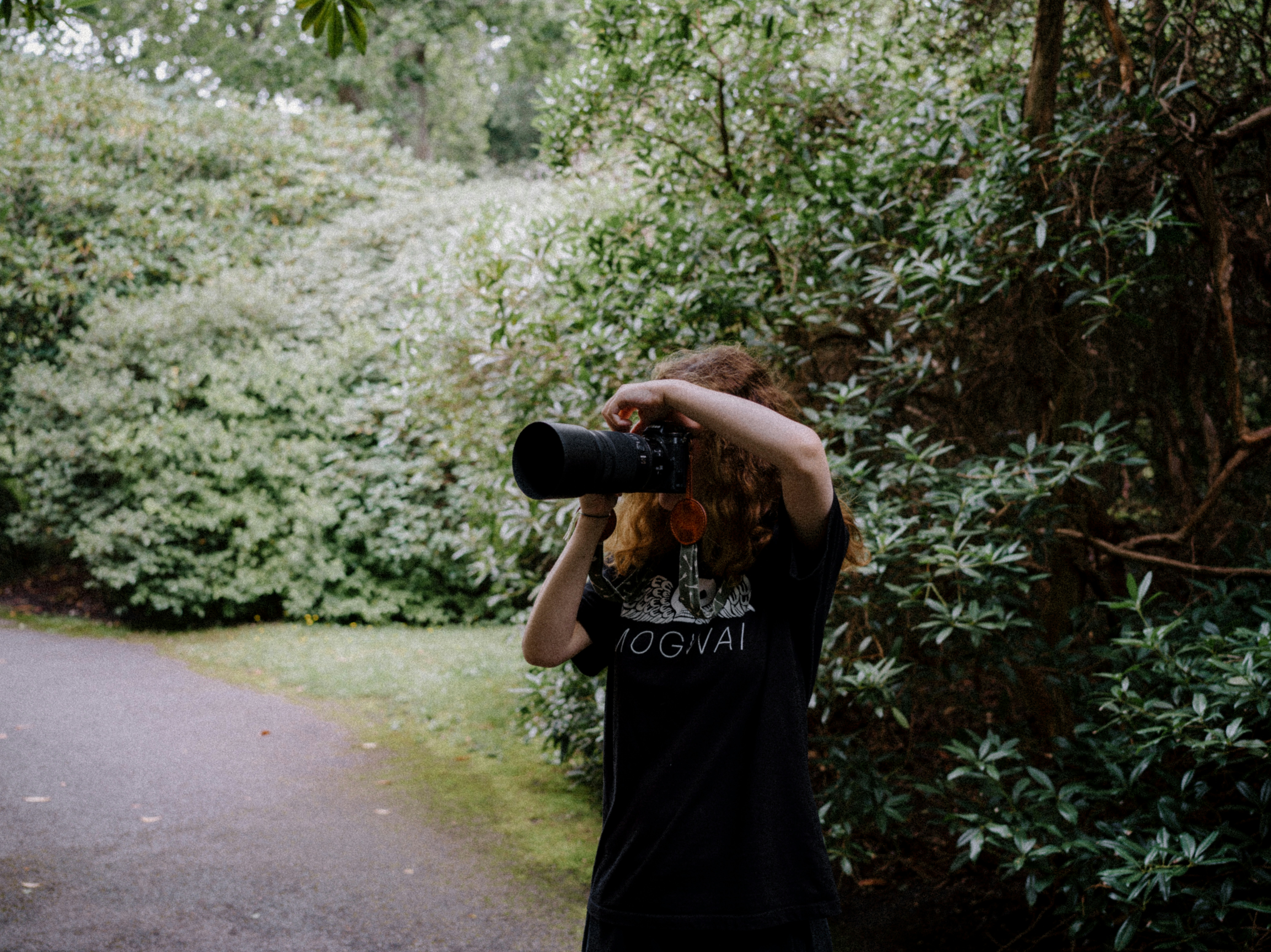 a woman taking a picture with a camera