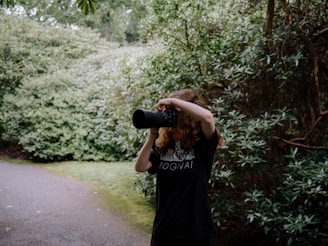 a woman taking a picture with a camera