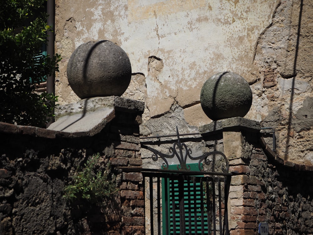 a gate that has some balls on top of it