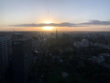 Split image showing London’s iconic skyline and Cairo’s bustling streets under sunset.