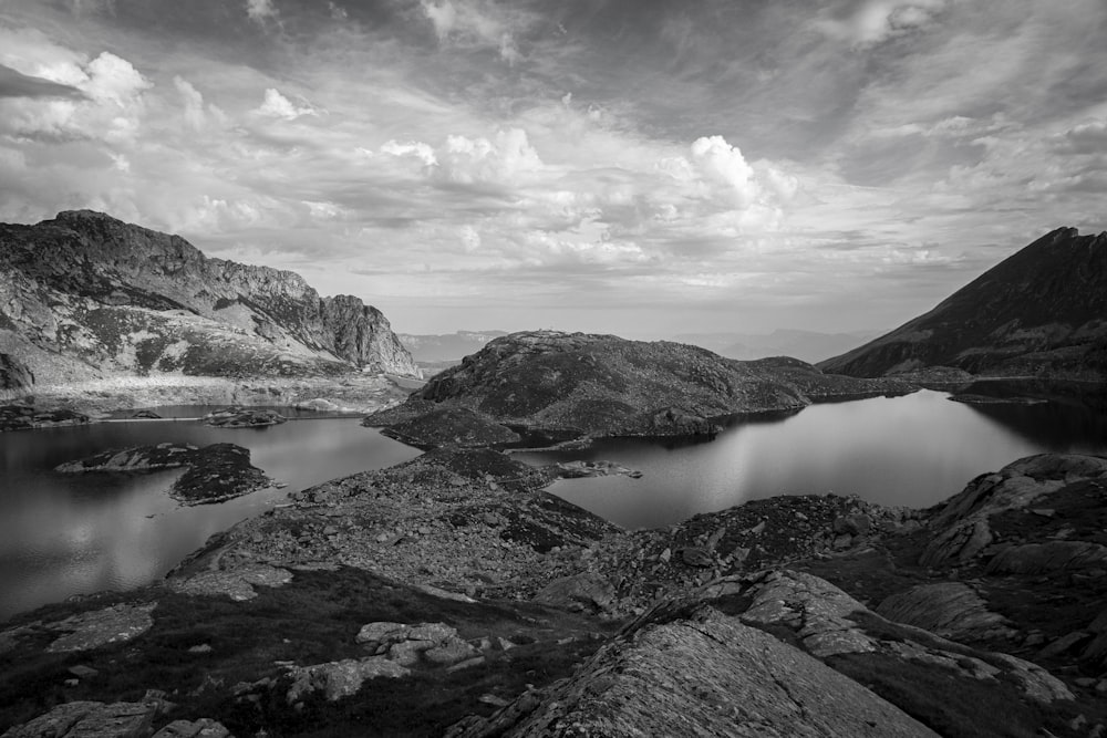 a black and white photo of a mountain lake