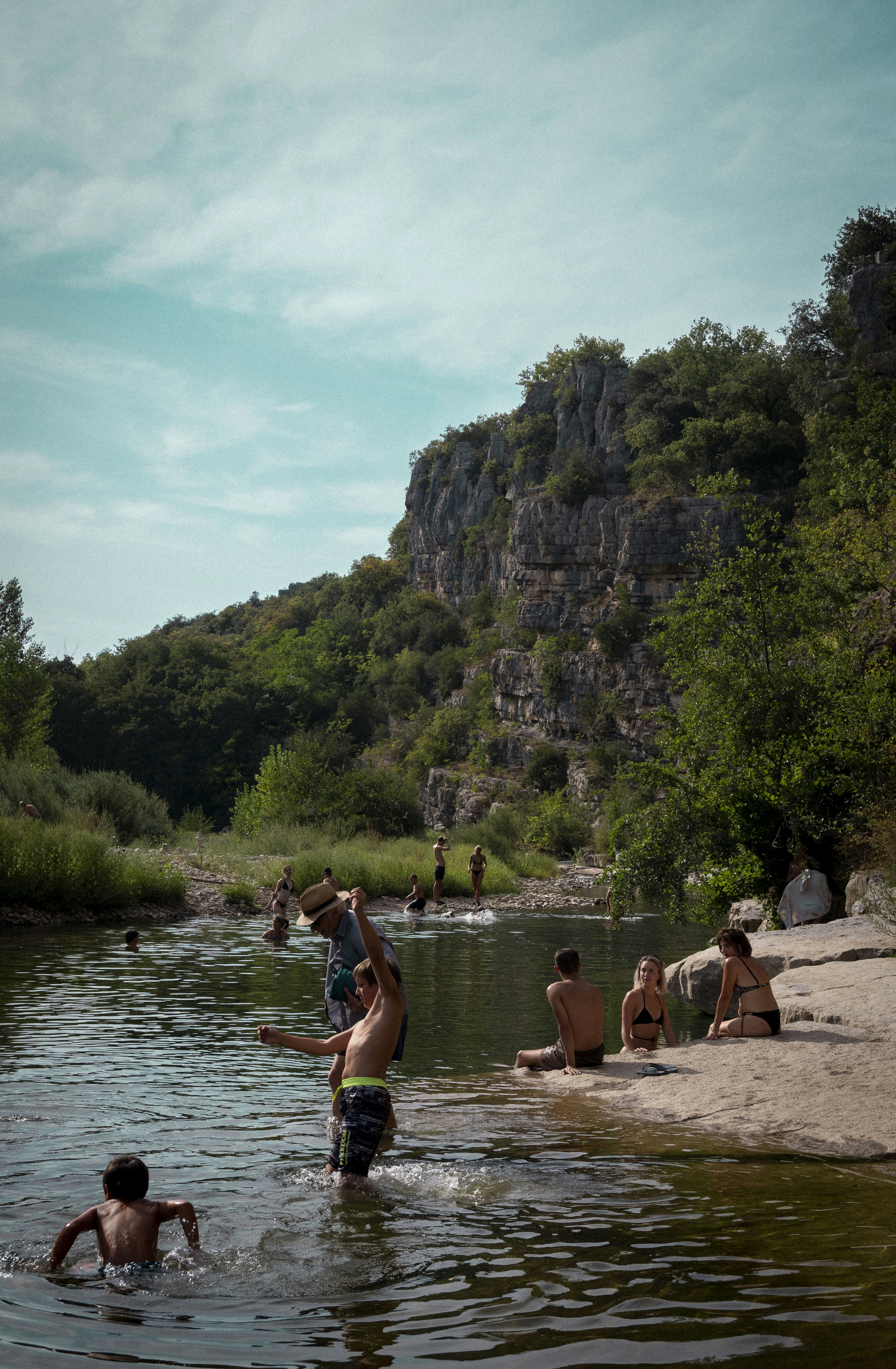 a group of people are wading in a river