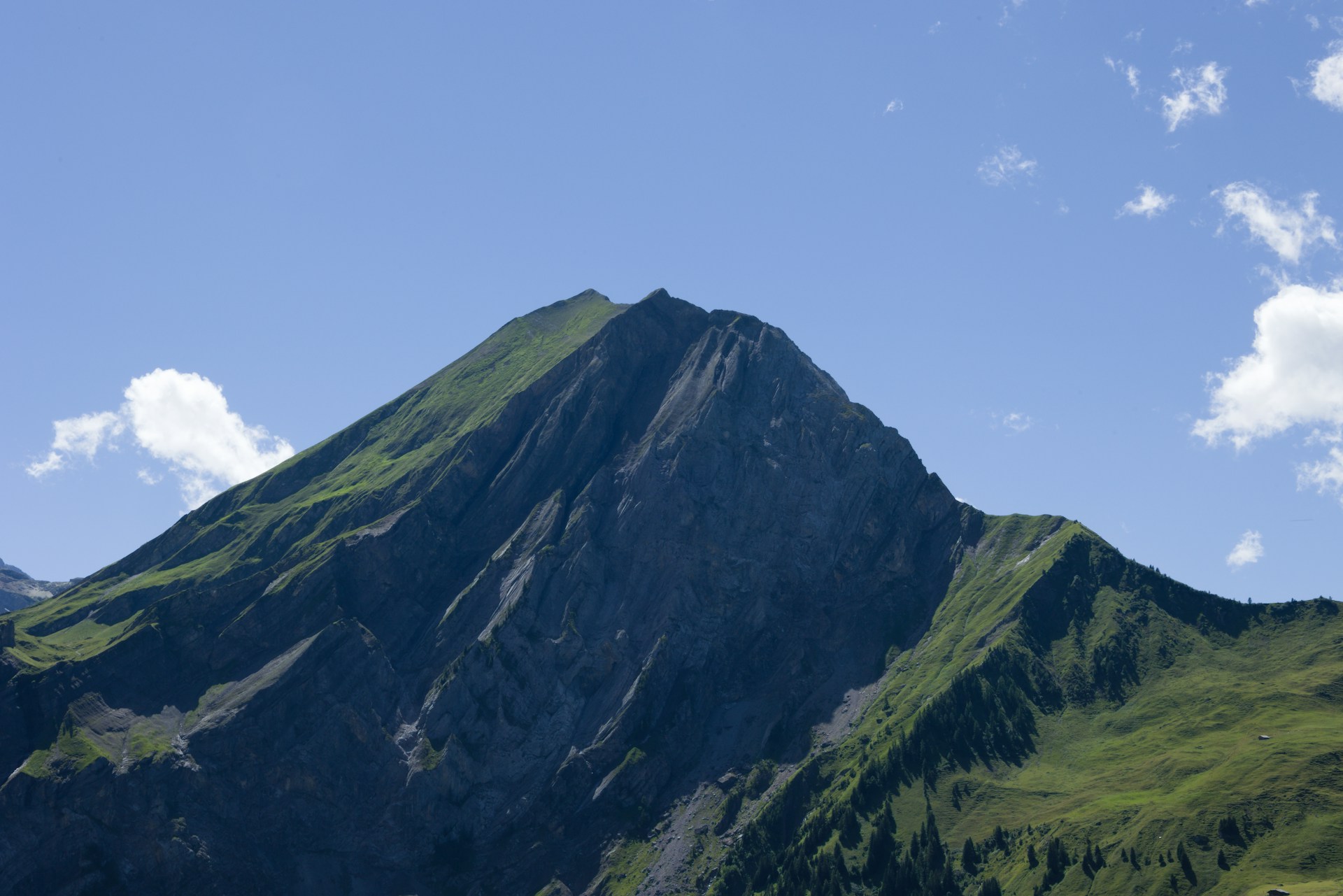 a tall mountain with a sky background