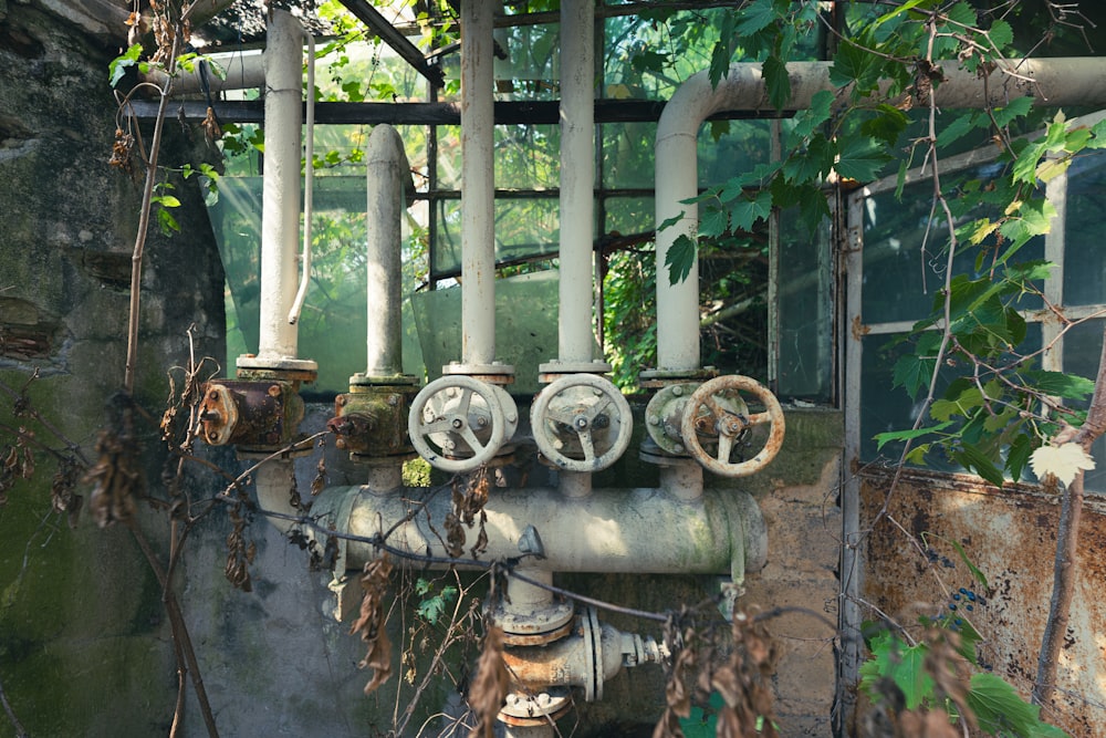 an old abandoned building with pipes and pipes