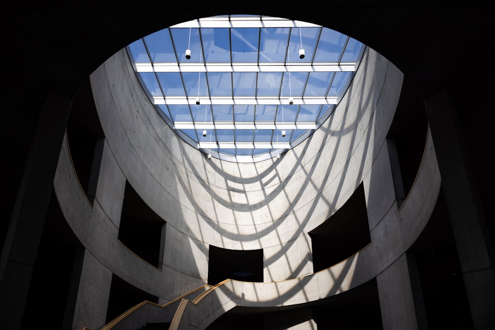 a building with a skylight and a spiral staircase