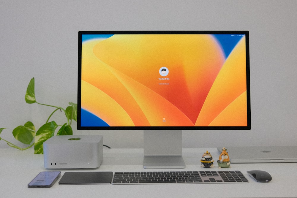 a desktop computer sitting on top of a white desk