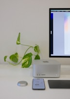 Minimalist workspace with AI-powered chatbot interface displayed on a screen.
