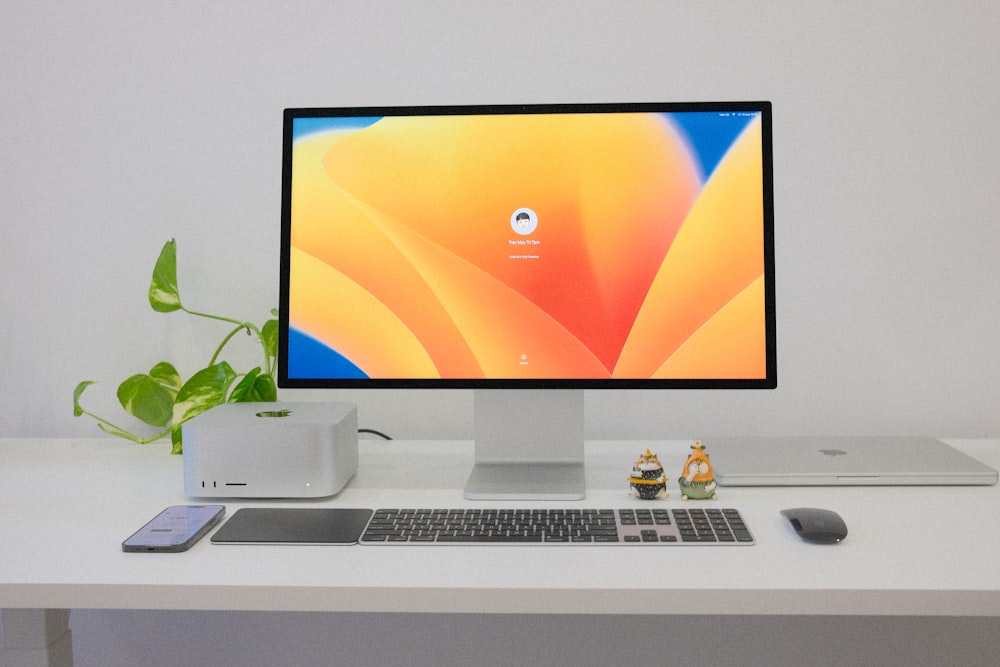 a desktop computer sitting on top of a white desk