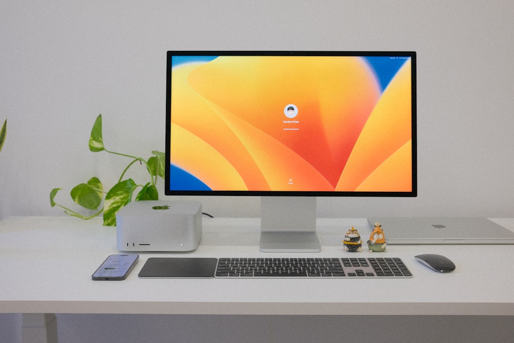a desktop computer sitting on top of a white desk