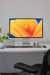 a desktop computer sitting on top of a white desk