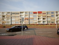 Wide shot of a residential area featuring multiple car shades.